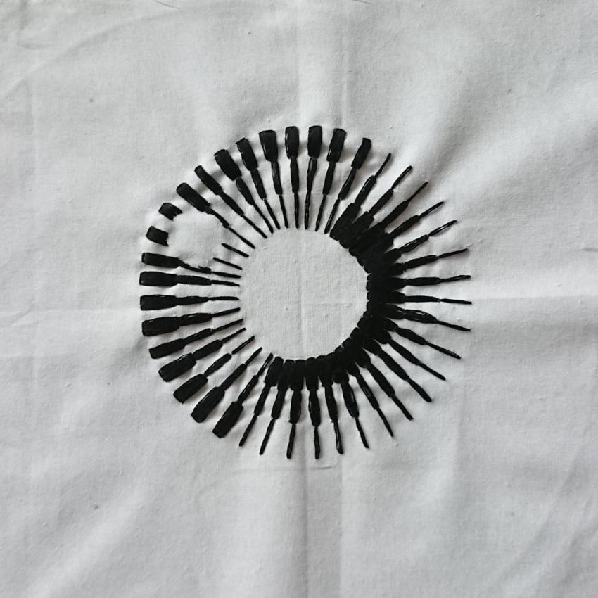 The Royal Astronomical Society's new logo unveiled in 2020. Embroidered in black thread on a white background.