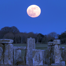 The Moon is pictured above Stonehenge.